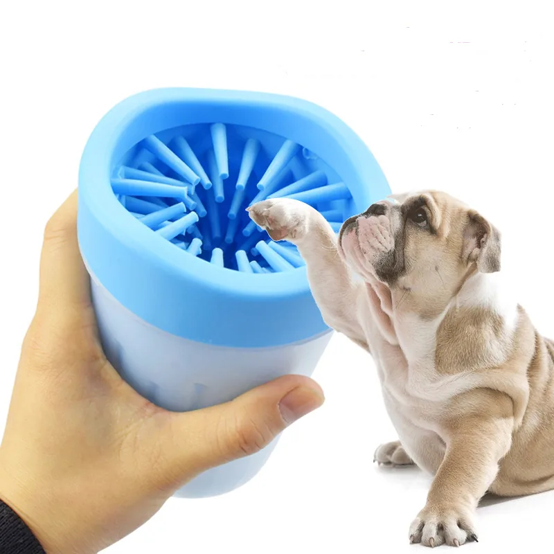 Blue Paw Rinse Cup held up to a bulldog's raised paw